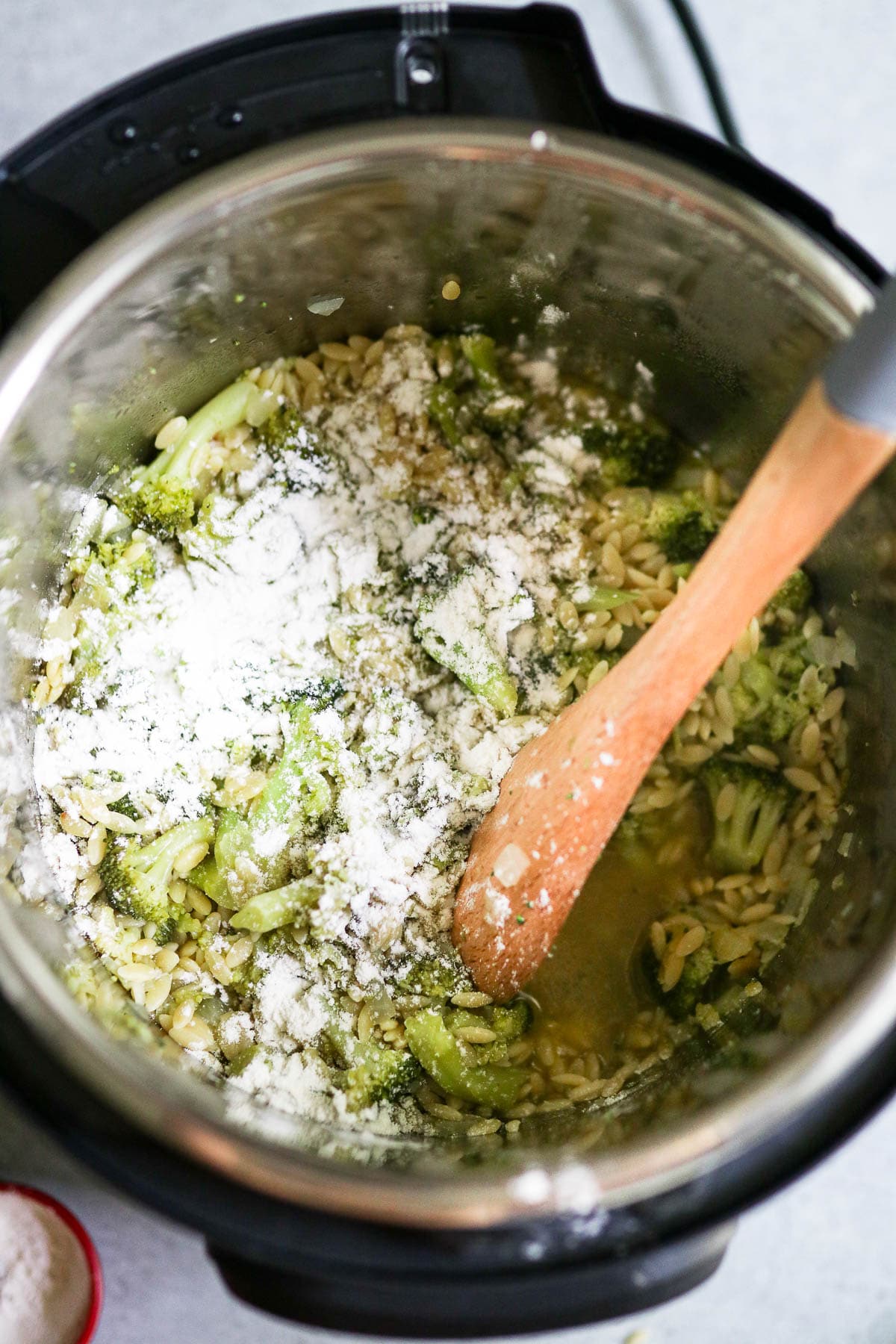 photo of cooked broccoli and orzo with flour in the instant pot