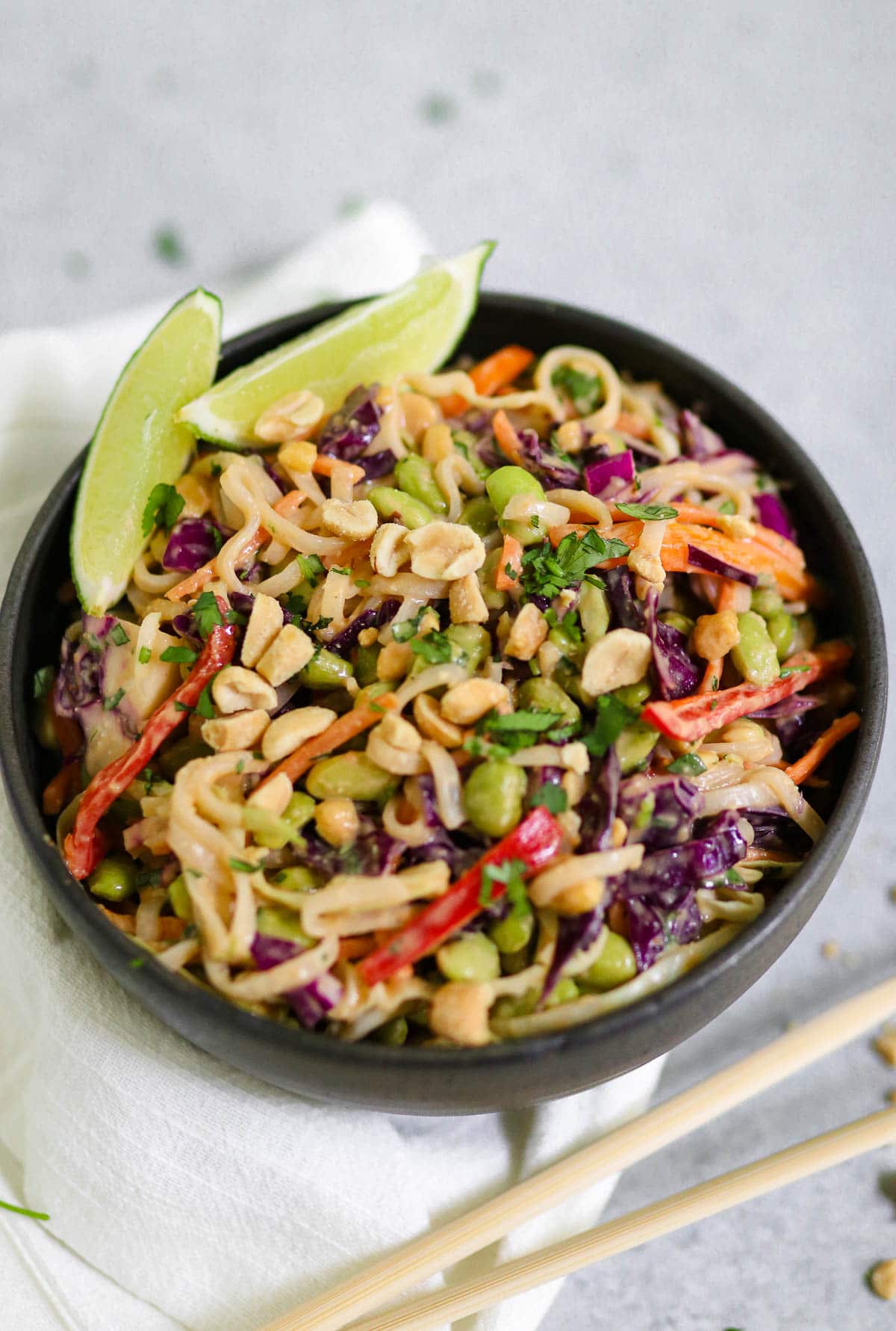 photo of finished dish in a black bowl with chopsticks on the side