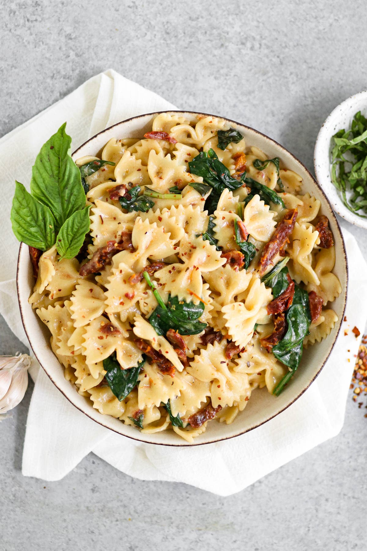 photo of finished dish with basil garnish on a white towel