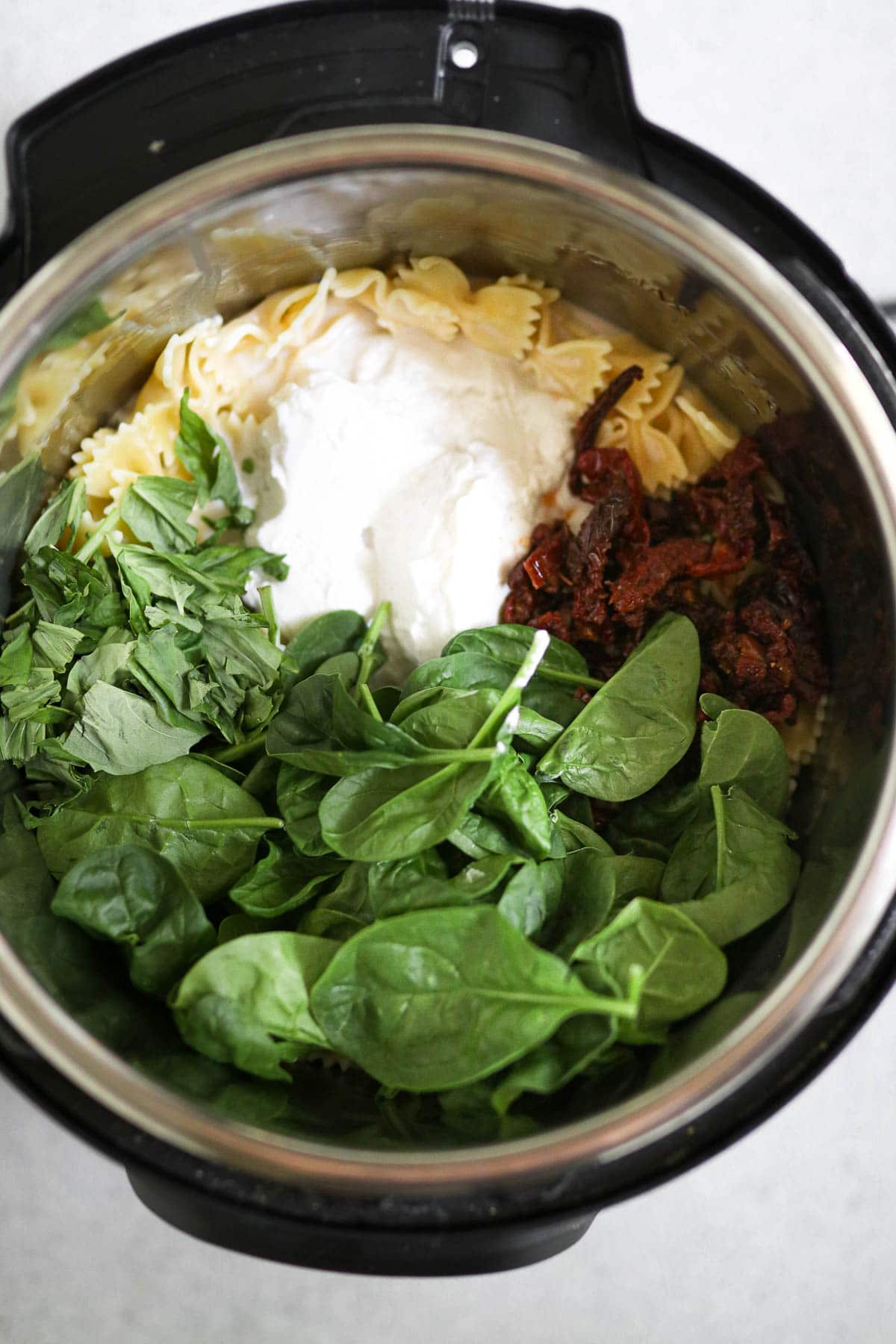 photo of cooked pasta with added ingredients in the instant pot
