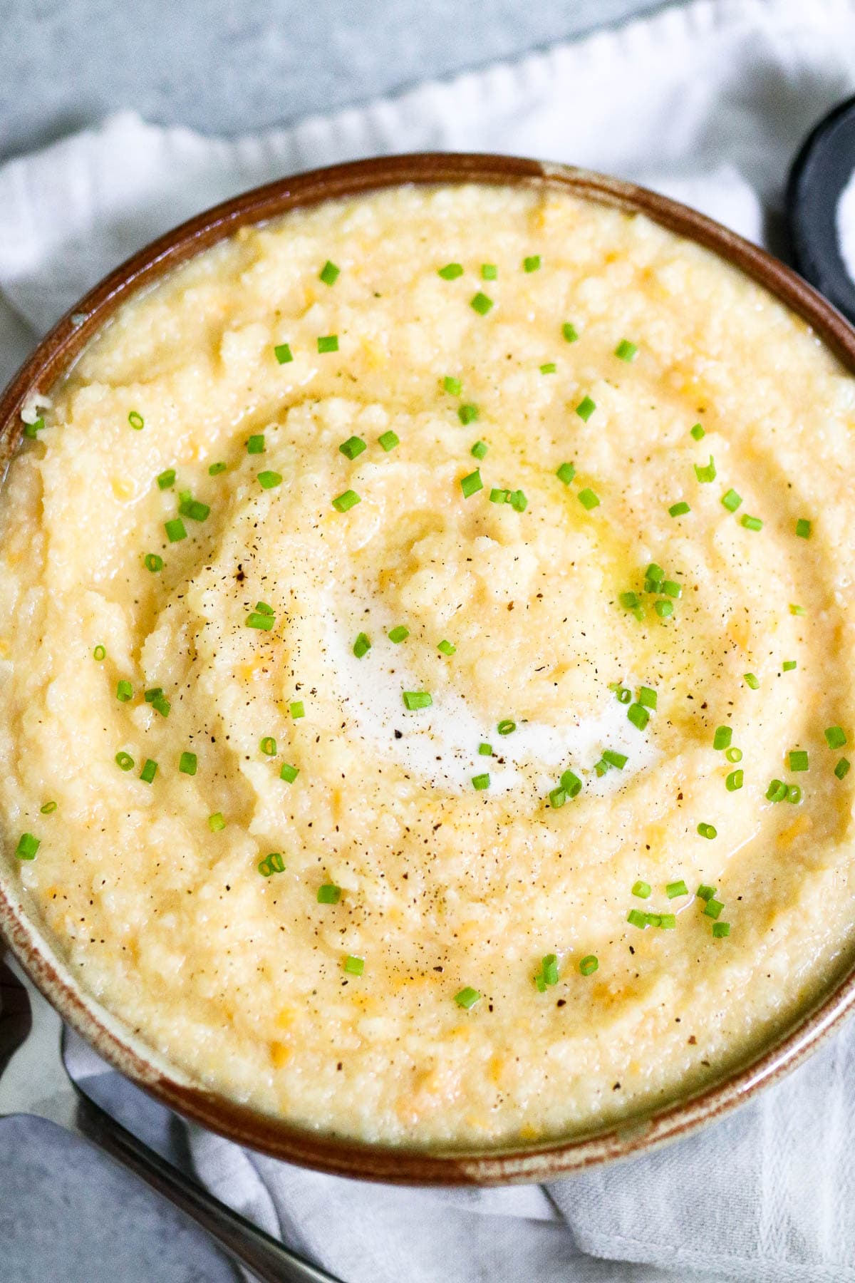 photo of cauliflower grits in a bowl on a white cloth