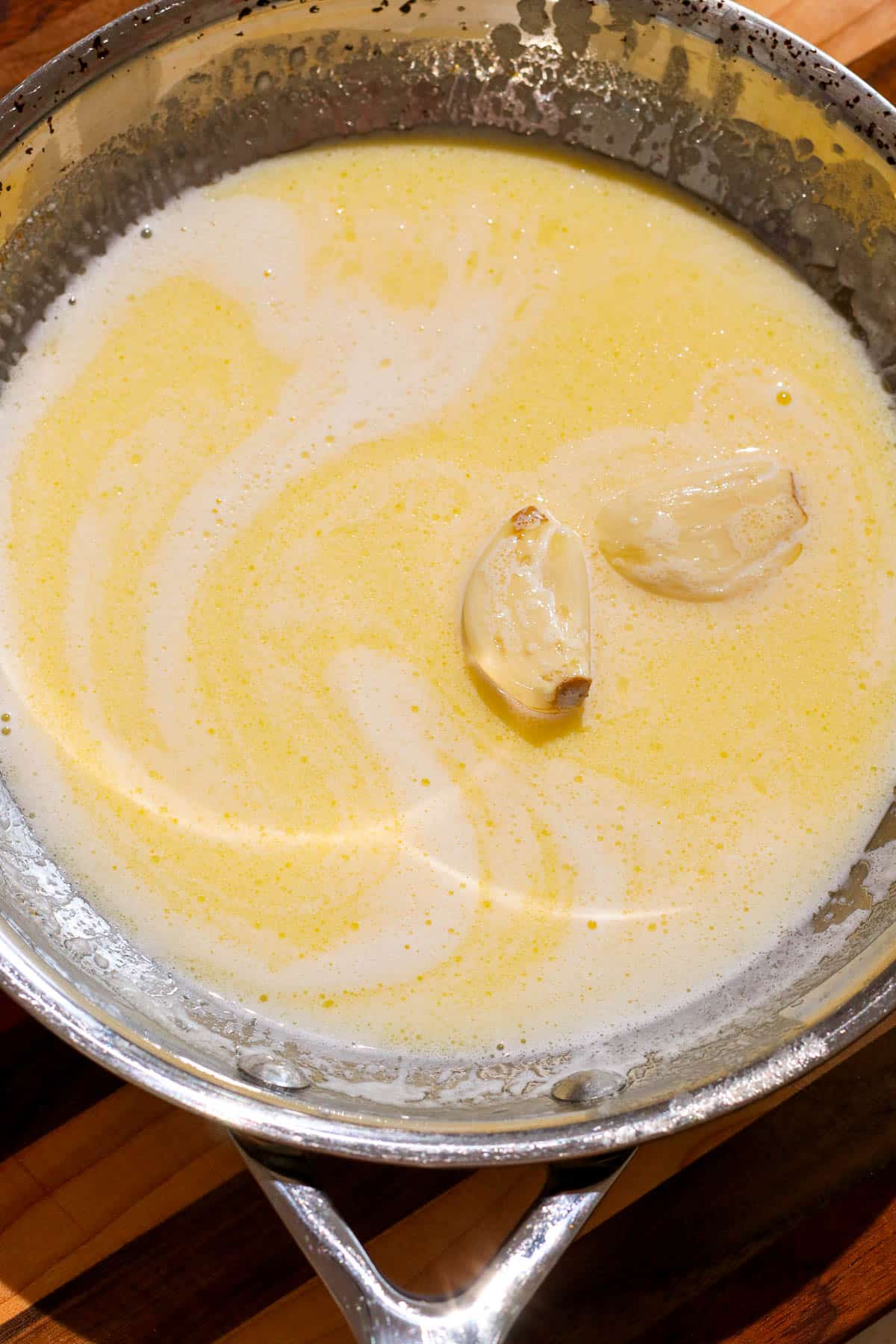 garlic and cream in a pan.