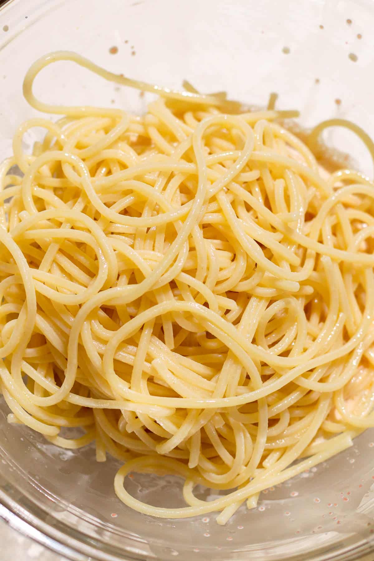 pasta added to sauce bowl. 