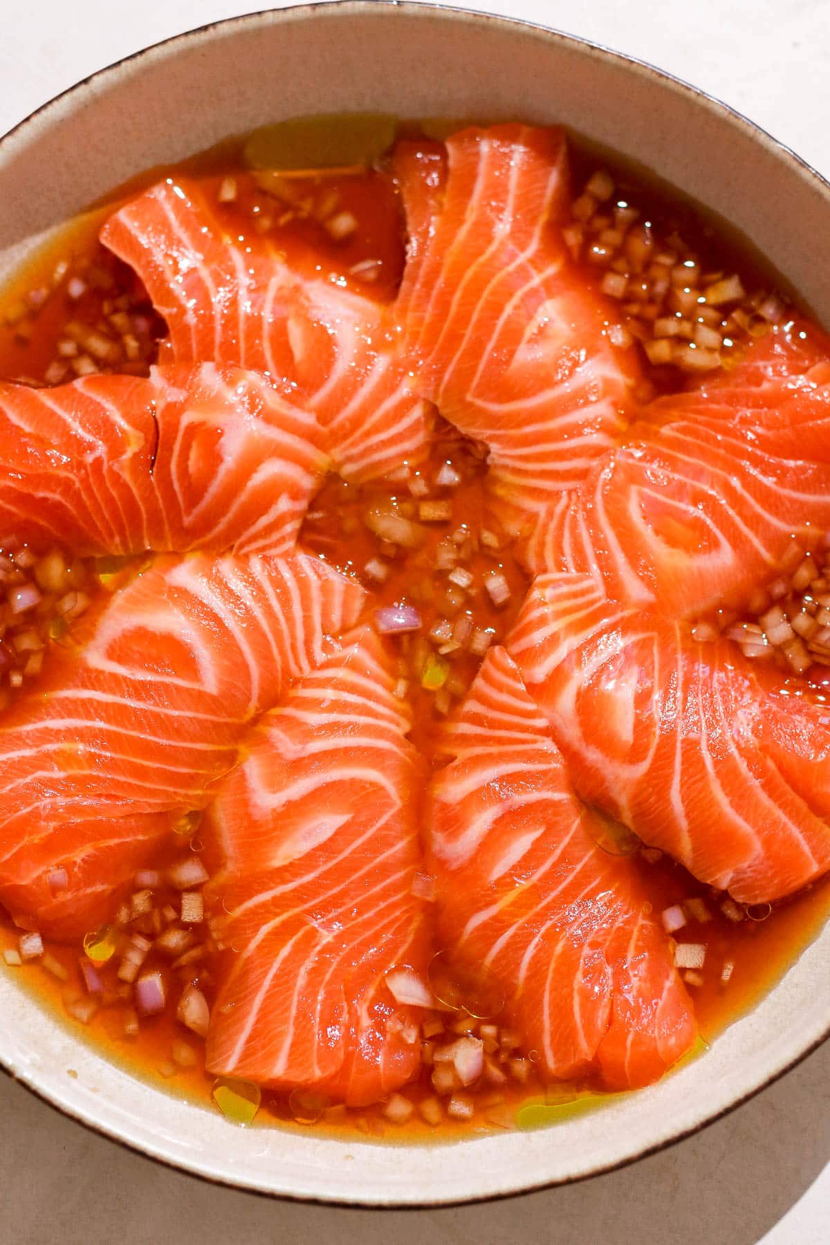 salmon in a plate with dressing.