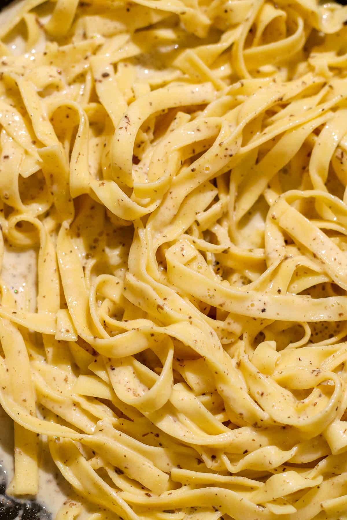 pasta mixed into sauce.
