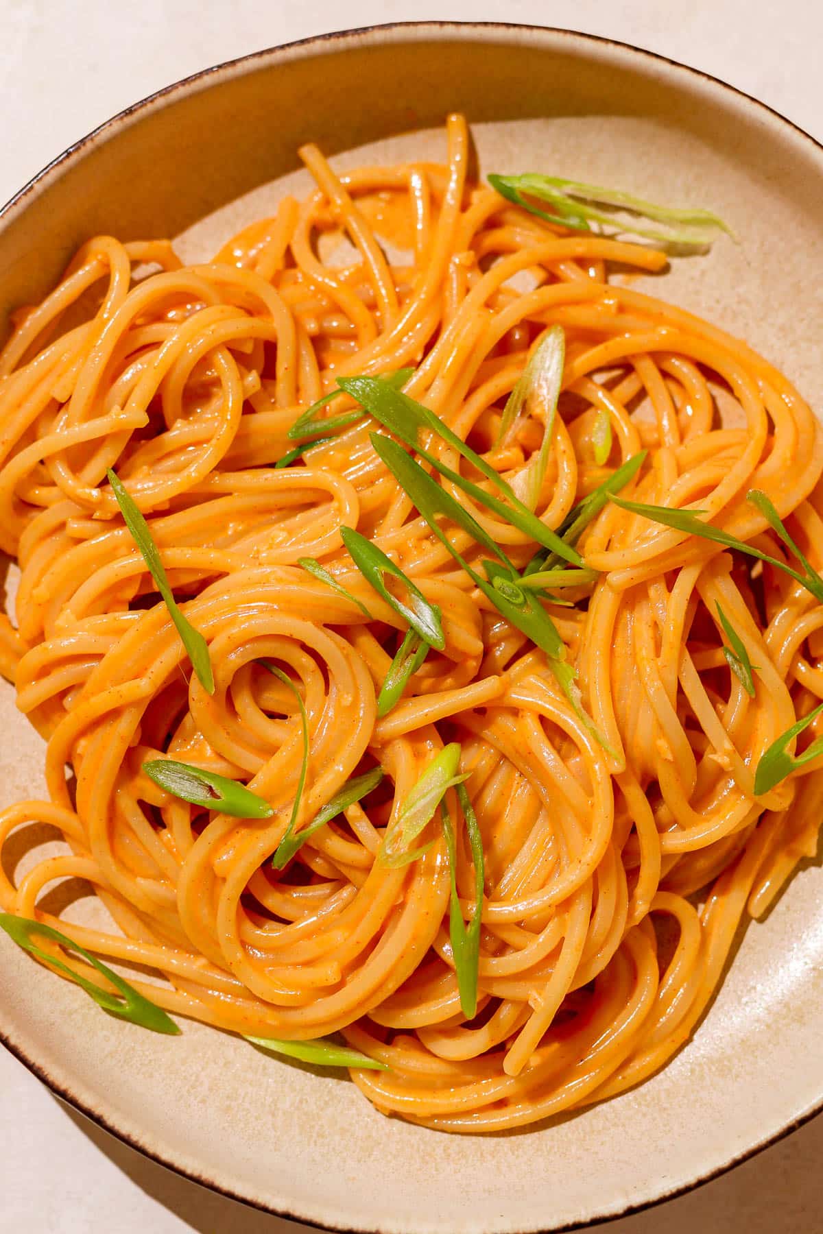 pasta with scallions in a plate.