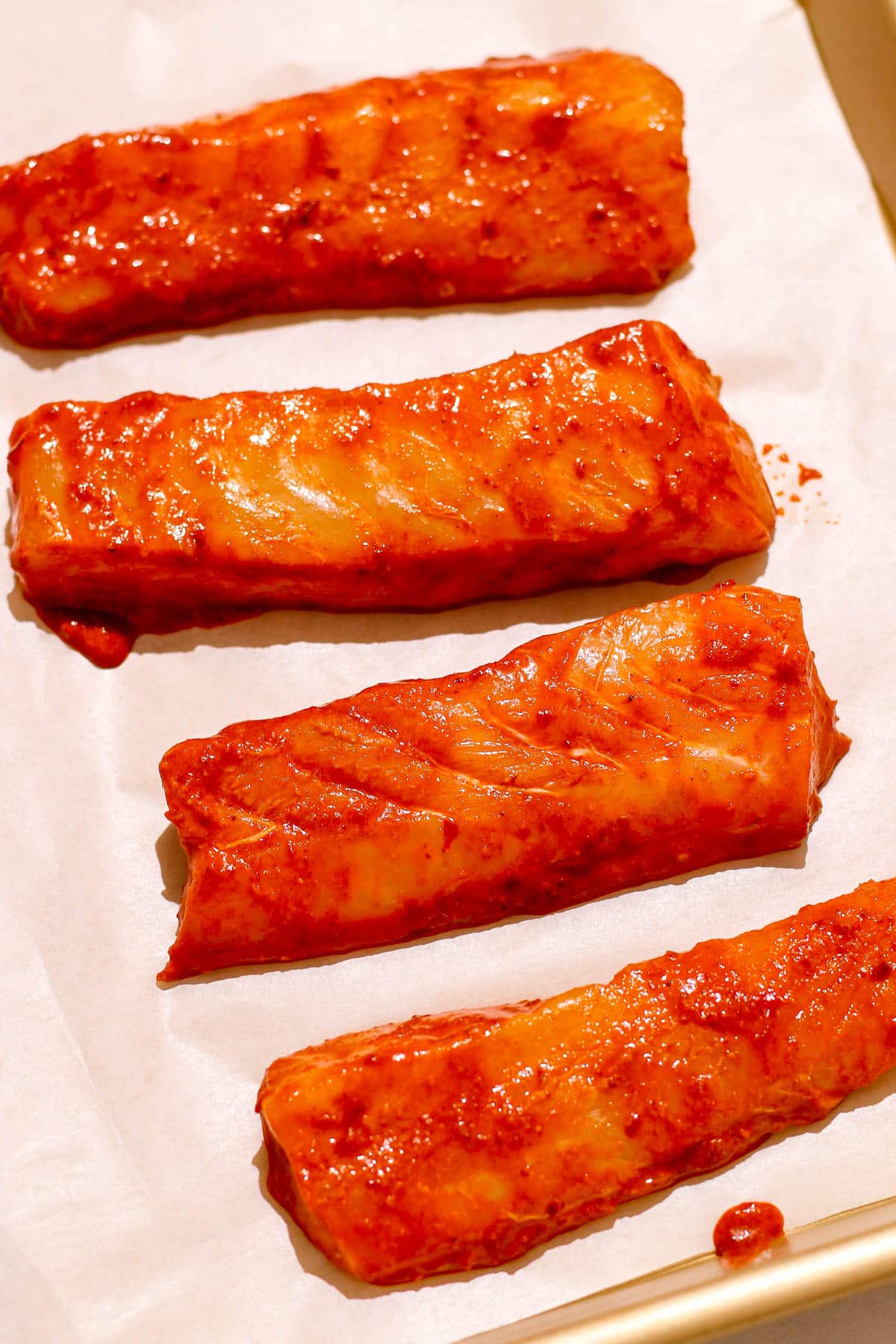 fish on tray before baking.