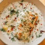 cod with dill and coconut in a bowl.